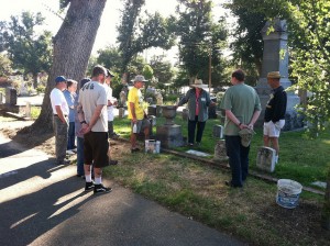Cemetery Preservationist Sharon Patrician (3rd from right) instructs the clean-up crew