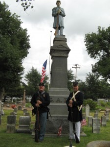Honor Guard members Greg Tracy (left) and Mike Drouin at the G.A.R. Monument in Old City Cemetery