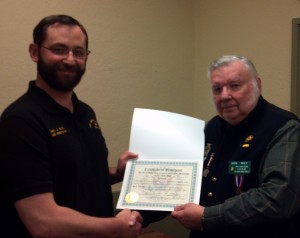 Former Company B Adjutant Don Wilt receives his retirement certificate from District Commander Marti.